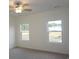 Bright bedroom with plush carpeting, ample natural light, and a ceiling fan at 329 Palmetto Sand Loop, Conway, SC 29527