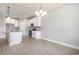 Bright dining room with hardwood floors and chandelier at 650 Timber Creek Dr., Loris, SC 29569