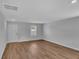 Living room with wood flooring, an exterior door and a window at 1053 Kinness Dr., Conway, SC 29527