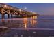 Night view of pier with lights reflecting on water at 232 Castle Dr. # 232, Myrtle Beach, SC 29579