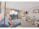 Living room boasts ocean views, comfy seating, and a dining area at 6900 N Ocean Blvd. N # 1238, Myrtle Beach, SC 29572