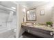 Bathroom with granite-topped vanity, sink, and shower at 6900 N Ocean Blvd. N # 1238, Myrtle Beach, SC 29572