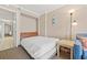 Bedroom with a queen bed, nightstand, and access to hallway at 6900 N Ocean Blvd. N # 1238, Myrtle Beach, SC 29572