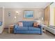 Cozy living room with a blue sofa, accent pillows, and end tables at 6900 N Ocean Blvd. N # 1238, Myrtle Beach, SC 29572