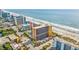 Aerial view of oceanfront resort, showing beach and surrounding buildings at 6900 N Ocean Blvd. # 625, Myrtle Beach, SC 29572