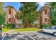 Front view of a brick apartment building with parking at 4273 Villas Dr. # 1007, Little River, SC 29566