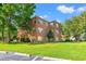 Brick building with lush green lawn and parking at 4273 Villas Dr. # 1007, Little River, SC 29566