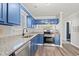 Updated kitchen, blue cabinets, granite countertops at 4273 Villas Dr. # 1007, Little River, SC 29566