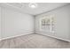 Bright bedroom with carpeted floor and large window at 4273 Villas Dr. # 1007, Little River, SC 29566