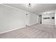 Open living area with neutral decor and carpet at 4273 Villas Dr. # 1007, Little River, SC 29566