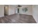 Bright living room with wood-look flooring and access to the outdoors at 4935 Trooper Ln., Loris, SC 29569