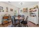 Charming dining room with round table, four chairs, and decorative hutch at 643 Trap Shooter Circle, Longs, SC 29568