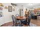 Dining area features a round table with four chairs near the kitchen at 643 Trap Shooter Circle, Longs, SC 29568