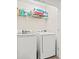 Bright laundry room with washer and dryer at 643 Trap Shooter Circle, Longs, SC 29568