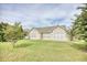 House back view with grassy lawn and mature trees at 812 Lalton Dr., Conway, SC 29526