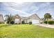 Brick and shingle ranch home with attached garage and manicured lawn at 812 Lalton Dr., Conway, SC 29526