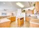 Well-equipped kitchen with island, wood cabinets, and white appliances at 812 Lalton Dr., Conway, SC 29526