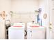 Laundry room with washer, dryer, and overhead shelving at 812 Lalton Dr., Conway, SC 29526