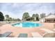 Community pool with lounge chairs and surrounding patio at 812 Lalton Dr., Conway, SC 29526