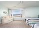 Bedroom with twin beds, sitting area, and ocean view at 2209 S Waccamaw Dr., Murrells Inlet, SC 29576