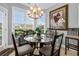Bright breakfast nook with glass table and seating for four, overlooking backyard at 505 Quincy Hall Dr., Myrtle Beach, SC 29579