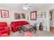 Relaxing sitting area featuring red sofas and artwork at 505 Quincy Hall Dr., Myrtle Beach, SC 29579
