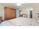 Bedroom with wooden armoire and access to other rooms at 505 Quincy Hall Dr., Myrtle Beach, SC 29579