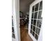 Living room with hardwood floors, sofa, and access to a balcony at 1538 Lanterns Rest Rd. # 303, Myrtle Beach, SC 29579