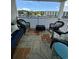 Waterfront balcony with wicker furniture and seating for four at 1538 Lanterns Rest Rd. # 303, Myrtle Beach, SC 29579