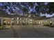 Elegant home exterior at dusk with courtyard at 3601 Ocean Blvd. N, Myrtle Beach, SC 29577