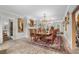 Formal dining room with a large table, chandelier, and brick flooring at 3601 Ocean Blvd. N, Myrtle Beach, SC 29577