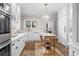 Modern kitchen with white cabinets, marble countertops, and an island at 3601 Ocean Blvd. N, Myrtle Beach, SC 29577
