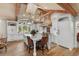 Open kitchen with white cabinets, exposed beams, and a large island at 3601 Ocean Blvd. N, Myrtle Beach, SC 29577