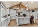 Gourmet kitchen with white cabinets, marble countertops, and a large island at 3601 Ocean Blvd. N, Myrtle Beach, SC 29577