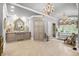 Large bathroom with double vanity, chandelier, and a soaking tub at 3601 Ocean Blvd. N, Myrtle Beach, SC 29577