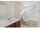 Bathroom with single vanity, toilet, and bathtub at 2248 Beauclair Ct., Myrtle Beach, SC 29579