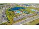 Aerial view showing community pool, tennis courts, and nearby homes at 2248 Beauclair Ct., Myrtle Beach, SC 29579