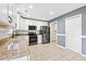 Kitchen with granite countertops, white cabinets, and stainless steel appliances at 2248 Beauclair Ct., Myrtle Beach, SC 29579