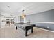 Dining room with pool table, kitchen access, and modern chandelier at 2248 Beauclair Ct., Myrtle Beach, SC 29579