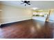 Bright living room featuring dark hardwood floors and access to a patio at 4819 Orchid Way # 104, Myrtle Beach, SC 29577