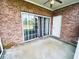 Screened porch with brick walls and sliding glass doors at 4819 Orchid Way # 104, Myrtle Beach, SC 29577