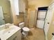 Bathroom with shower, toilet, vanity, and stackable washer/dryer at 4819 Orchid Way # 104, Myrtle Beach, SC 29577