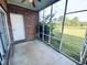 Screened porch with brick walls and view of the golf course at 4819 Orchid Way # 104, Myrtle Beach, SC 29577