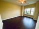 Spacious bedroom with large window and dark laminate flooring at 4819 Orchid Way # 104, Myrtle Beach, SC 29577