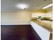 Kitchen with breakfast bar and light-colored cabinets at 4819 Orchid Way # 104, Myrtle Beach, SC 29577