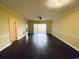 Open living room with hardwood floors and neutral colored walls at 4819 Orchid Way # 104, Myrtle Beach, SC 29577