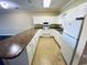 U-shaped kitchen with ample storage and granite countertops at 4819 Orchid Way # 104, Myrtle Beach, SC 29577