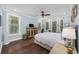 Spacious bedroom with light blue walls, hardwood floors, and a bay window at 130 Hagar Brown Rd., Murrells Inlet, SC 29576