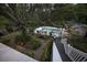 Inviting pool and patio area with a pond and walkway at 130 Hagar Brown Rd., Murrells Inlet, SC 29576