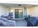 Covered patio with sliding glass doors and outdoor storage at 893 Barn Owl Ct. # 893, Myrtle Beach, SC 29579